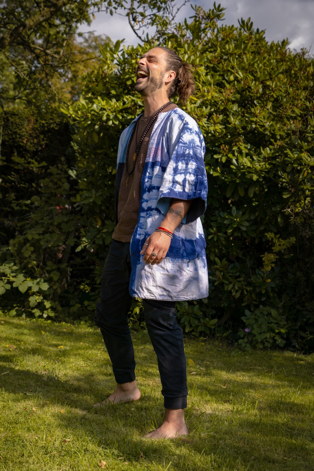 Konrad Sommer laughing outdoors.