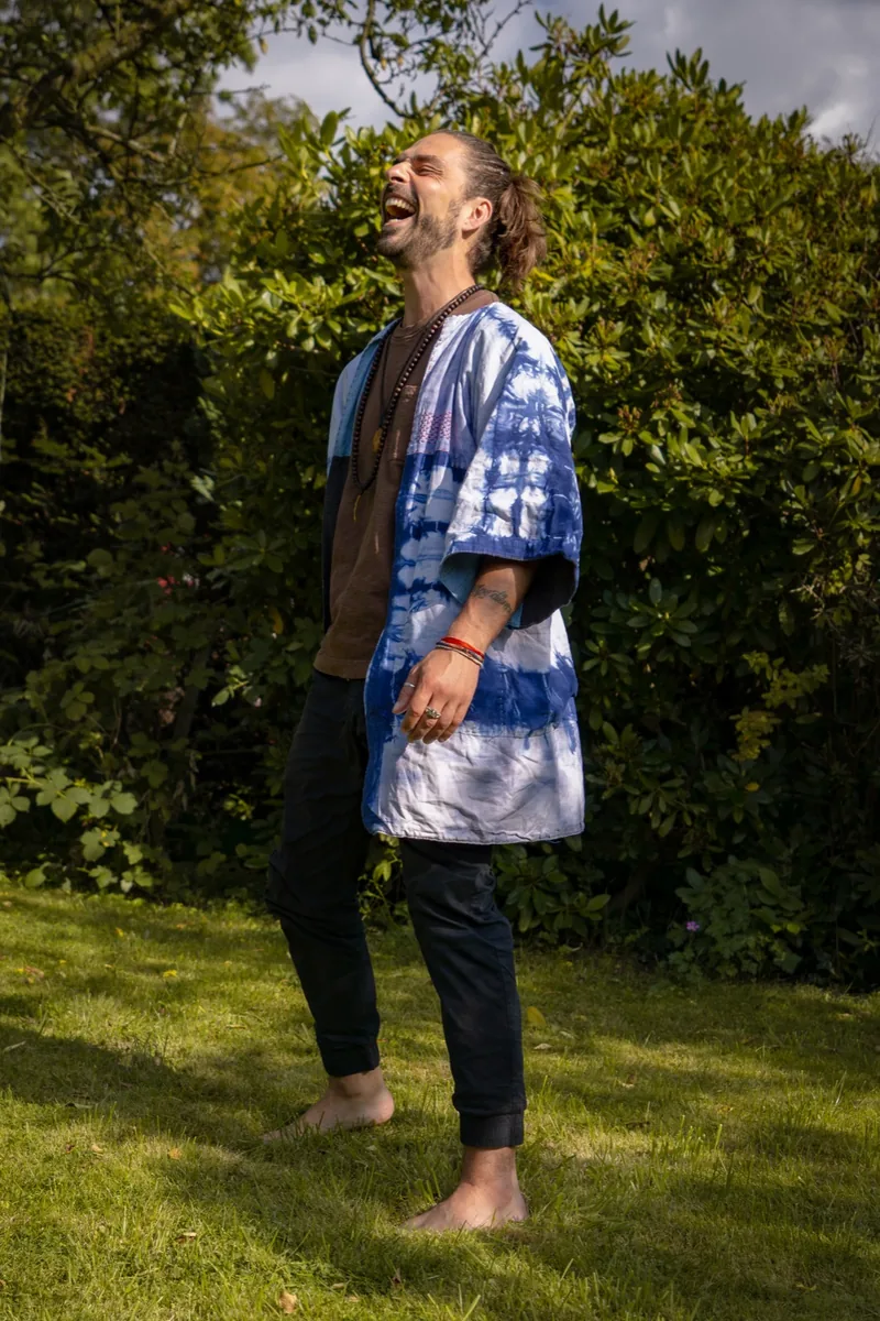 Konrad Sommer laughing outdoors.